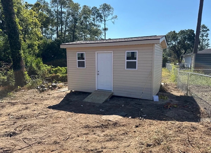 Same structure fully rebuilt with new siding, roofing, and trim